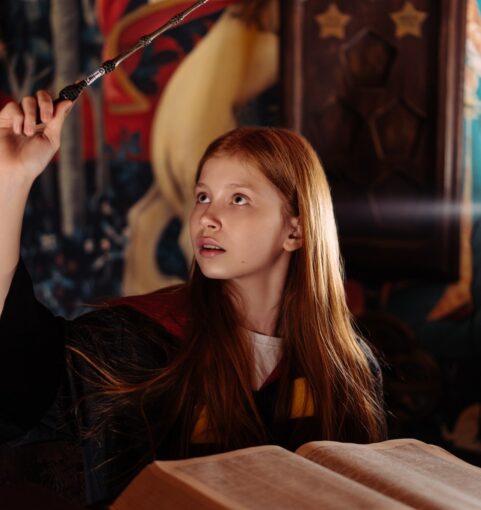 girl use wand to make a spell 