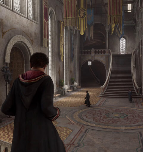 A character holding wand inside Hogwarts Legacy game